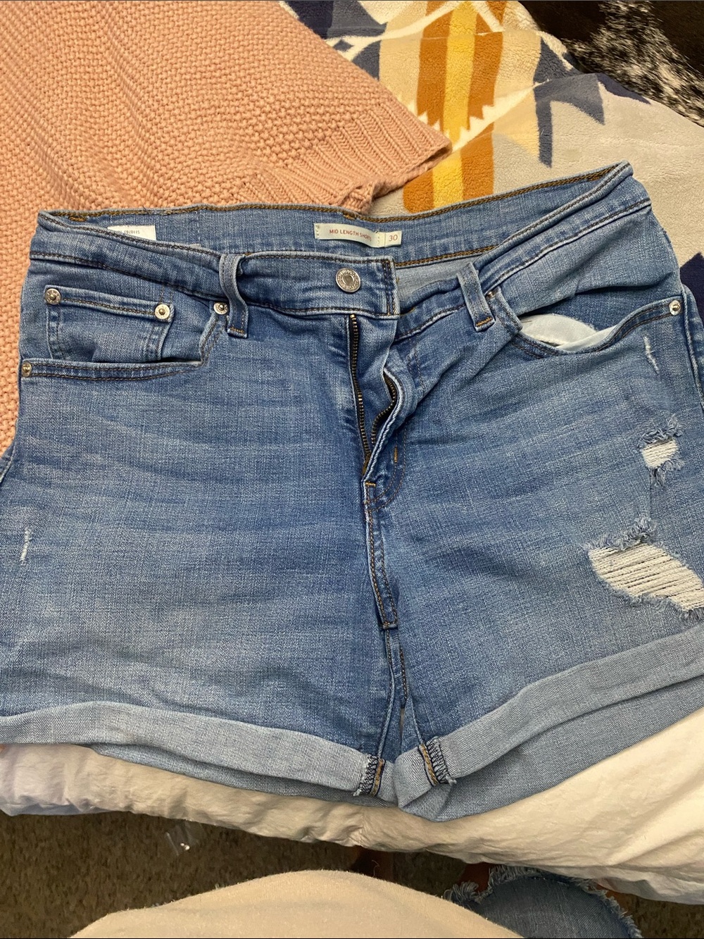 Levi's Medium Blue Distressed Roll Cuff mid-length Jean Shorts